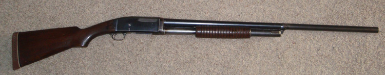 Notice the missing bluing on the receiver. It looks like someone tried to make it look like a side ejector. I'm thinking that someone sanded off some sort of electropencil identification.